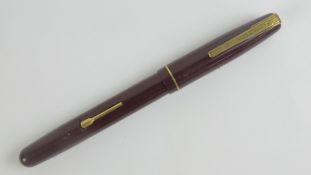 A vintage Watermans 'self-filler' fountain pen with original 14ct gold nib.