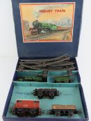 A Hornby train passenger set 0 gauge number 601 Goods Set comprising clockwork locomotive three