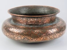 A heavy Middle Eastern copper plated planter having engraved pattern upon, approx 28cm dia.