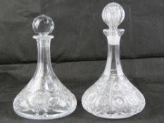 Two heavy cut glass 'ships' flat bottomed decanters, each with stopper.