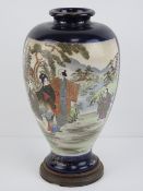A early 20th century Japanese shoulder vase having twin decorative panels upon a cobalt blue ground,