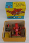 A Corgi gift set number 8 Massey Ferguson agricultural equipment containing combine harvester,