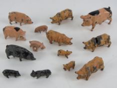 A quantity of assorted Britains hand painted lead pigs and piglets, fourteen in total.
