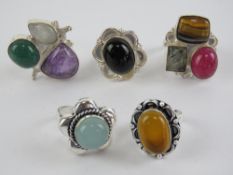Five hardstone rings each stamped 925, size O-P, including tigers eye and onyx.