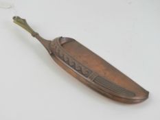 An Art Nouveau WMF crumb scoop made of copper and brass, marked with stamp verso.