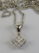 An 18ct white gold and diamond pendant on a 9ct white gold fine chain necklace,