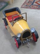 A 'Brum' peddle car having powder coated paint, steel construction,