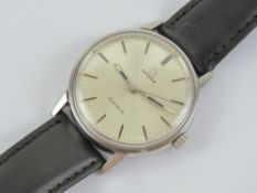 A vintage Omega Seamaster wristwatch having silvered dial with white metal hands, on leather strap.
