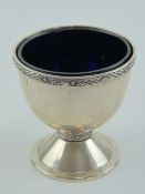 A HM silver raised pedestal salt with Bristol blue glass liner,