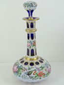 A delightful overlaid glass decanter of bulbous form, handpainted with birds, roses, peonies, etc,