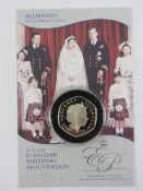 An Alderney Royal Mint Silver Proof Crown in protective plastic pod with certificate,