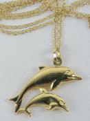 A 9ct gold fine chain, stamped 375, having dolphin pendant upon, no apparent hallmarks,