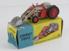 A Corgi Massey Ferguson 65 tractor with front loader and shovel, in original box.