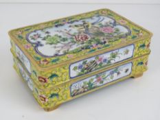 A Chinese Canton enamel on brass dressing table box having yellow ground with birds,