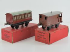 A Hornby 0 gauge number one passenger coach together with a goods brake van, in original boxes.
