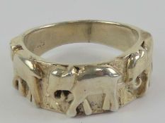 A 925 silver ring having trio of elephants upon, size O.