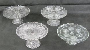 Four assorted pressed glass cake stands.