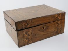 A Tumbridge ware walnut veneered work box, lid lifting to reveal pin cushion etc within, 29cm wide.