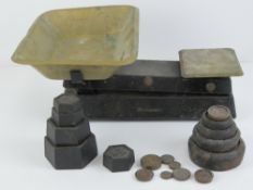 A Waymaster set of kitchen scales complete with brass pan, having assorted cast iron weights.