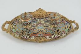 A delightful gilt brass and cloisonné standish having twin integral inkwells and cast in end
