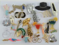 A quantity of assorted costume brooches including shoe, cocktails, cats, etc. Twenty-eight items.