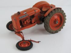 A scale model cast metal Nuffield tractor as made by Denzil Skinner Ltd.