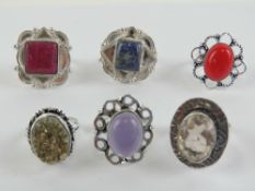 Six hardstone rings each stamped 925, size Q-R, including rose quartz and lapis lazuli.