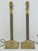 A pair of brass column table lamps, 37cm high.
