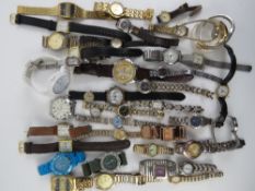 A large quantity of assorted men's and ladies wristwatches.
