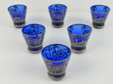 A set of six Venetian silver overlaid blue glass tot cups.