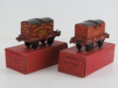 Two Hornby trains 0 gauge flat trucks with container.