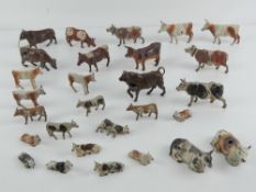 A quantity of assorted Britains hand painted lead bulls, cows and calves, thirty in total.