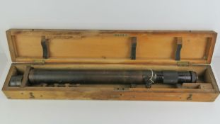 A Ross London brass telescope in wooden case with additional lenses, No73939, 71cm in length.