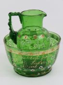 A Victorian handpainted green glass jug and bowl set 'a present from Weston Super Mare', bowl 11.