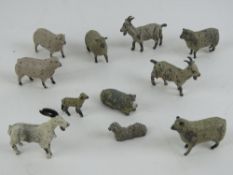 A quantity of assorted Britains hand painted lead sheep, lambs and goats, eleven in total.
