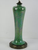 A green ceramic lamp base having brass base, for re-wiring, standing 31cm high.