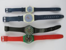 Four vintage Swatch watches.