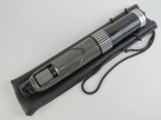 A telescope made by Greencat with carry