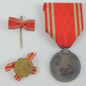 A WWII Japanese Red Cross medal and pin