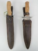 Two large Joker knives with scabbards.