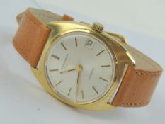 A vintage Longines automatic wristwatch on leather strap, silvered dial with date aperture.