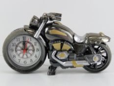 A contemporary clock in the form of a motorbike, 22cm in length.