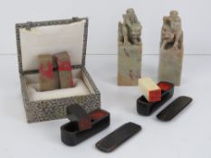 A pair of carved stone seals having deities with Fo Dog and ox respectively, each standing 9.