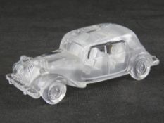 A glass paperweight in the form of a vintage Citroen motorcar, 19cm in length.