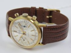 An Avia chronograph wristwatch having white dial with two subsidiary dials and leather strap.