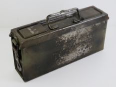 A WWII German MG34/42 E tin to hold a gunners Waffenmeister tool kit, with marks upon.