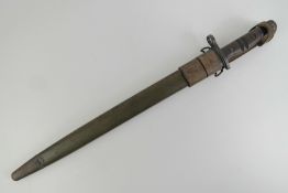 A WWI US P17 Remington bayonet dated 1917, with scabbard and leather frog, blade measuring 43cm.