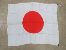 A WWII Japanese red rising sun flag, measuring approx 90 x 70cm, slightly a/f.
