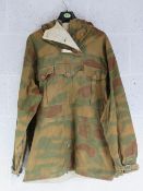 A reproduction WWII German Army jump smock.