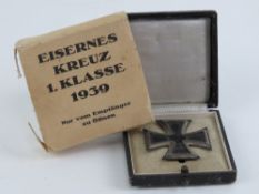 A WWII German Iron Cross 2nd class, in box with card sleeve, with backing.